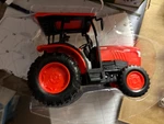 7"LONG New Ray Orange Kubota L6060 Tractor , No Packaging #. Fixed Price $9.50.