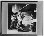Photo:u.s. Navy Men Marking Tail Wheel Aircraft Hangar 1940S. Fixed Price $13.49.