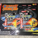 Auto World X-traction Ultra-g Country Charger Chase 1:64 Slot Car Set SRS335. Fixed Price $200.00.
