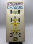 Cox Universal 1/24 Scale Adjustable Sidewinder Chassis Slot Car Racing Kit. Fixed Price $229.00.