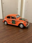 Vintage 1960S Orange Vw Bug Battery Operated Metal Tin Toy Race Car Bump Go. Fixed Price $64.99.