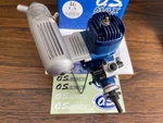 Box "os Max 46 La" Model Airplane Engine With Muffler. Fixed Price $130.00.