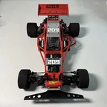Modified Kyosho Javelin 1/10 Scale Buggy With Red Roll Cage Body. Fixed Price $457.00.