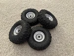 Treal Hobby Type N 1.9" Multi-spoke Beadlock Wheels W/ JCO4060-02 Megalith Tires. Fixed Price $99.99.