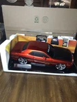 New Bright Dodge Challenger R/t 49 Mhz Orange 9.6V Remote Control Car 1:10 Scale. Fixed Price $100.00.